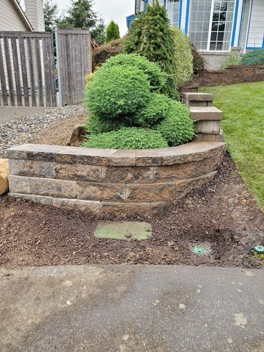 Curved retaining wall with plantings, residential landscaping Battle Ground WA