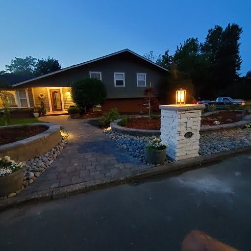 Stone entry column with dramatic night lighting, Clark County WA